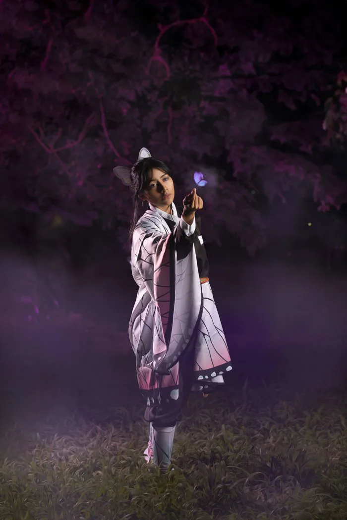 Young Woman in a Kochou Shinobu Cosplay Standing in a Park at Night · Free  Stock Photo